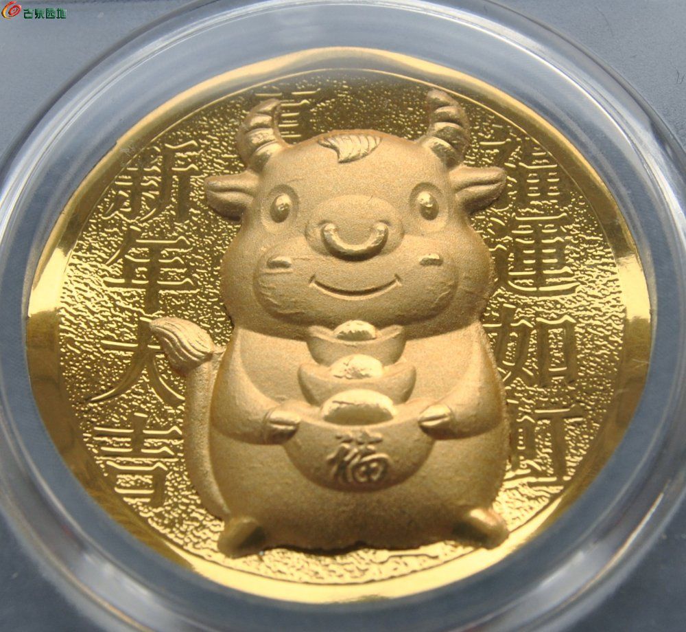 评级0.3克纯金立体金牛送元宝纪念章局2.jpg